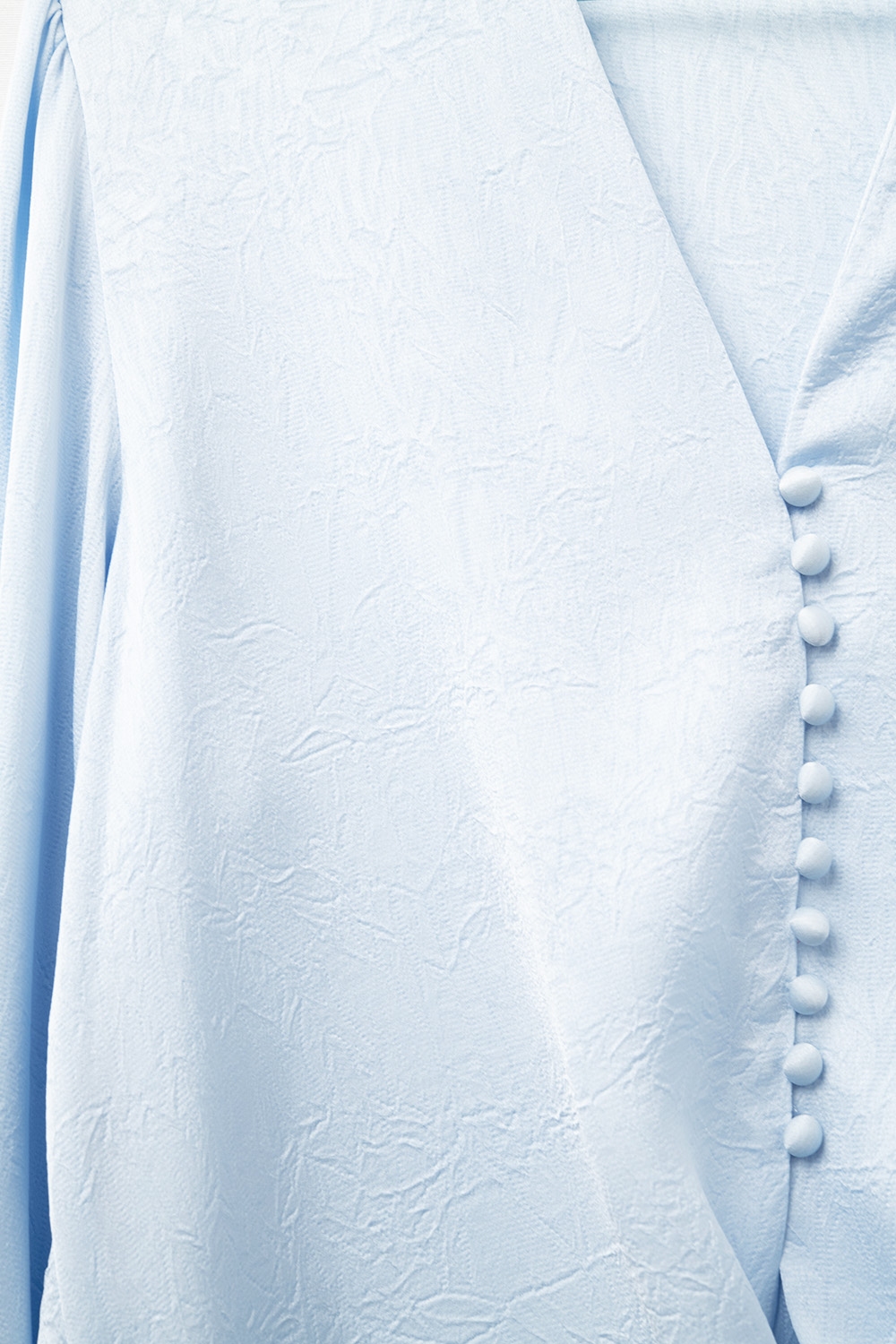 Camisa recortada abotonada en azul con nudo Camisa recortada abotonada en azul con nudo