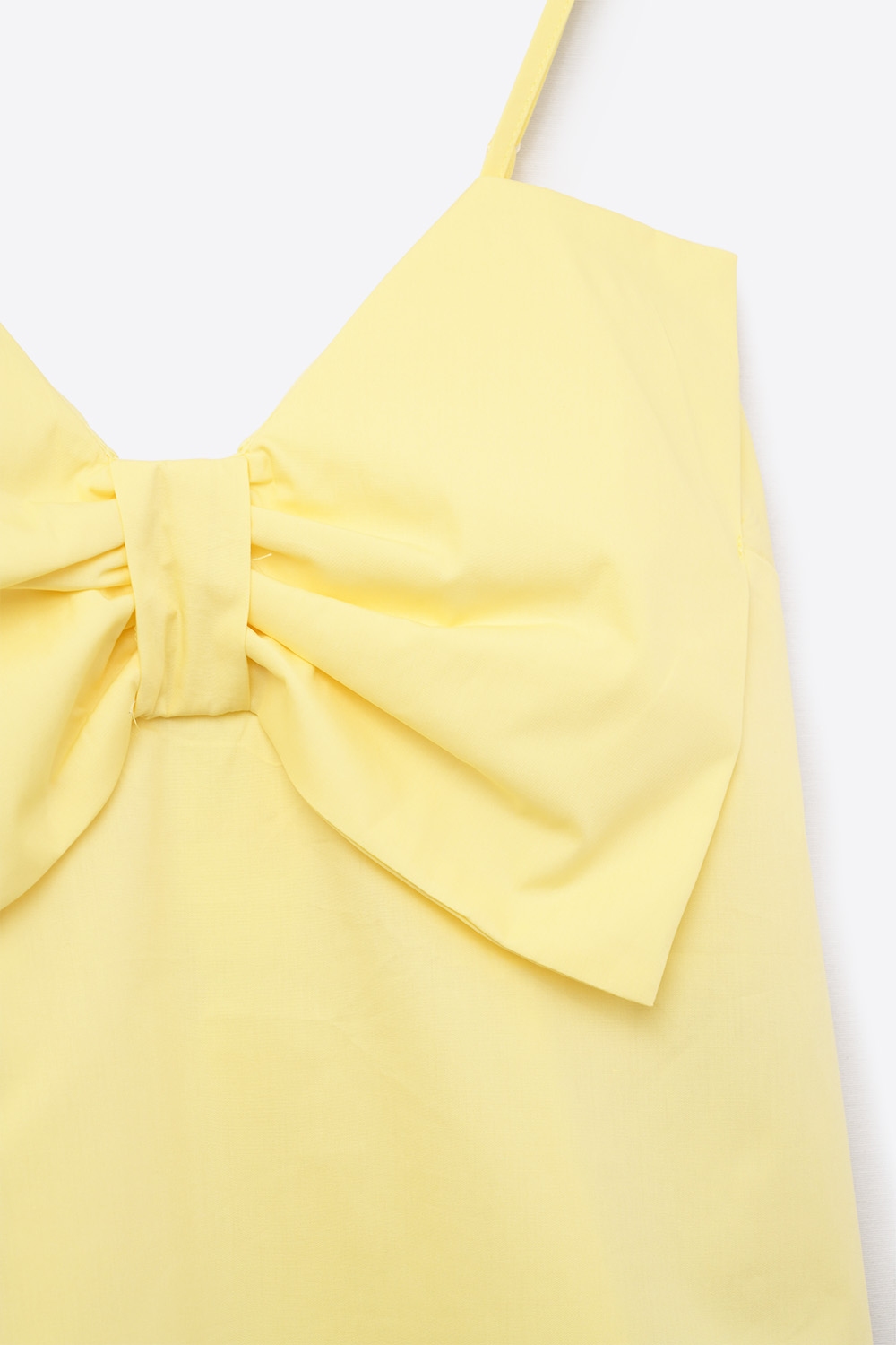 Top de popelín amarillo con detalle de lazo Top de popelín amarillo con detalle de lazo