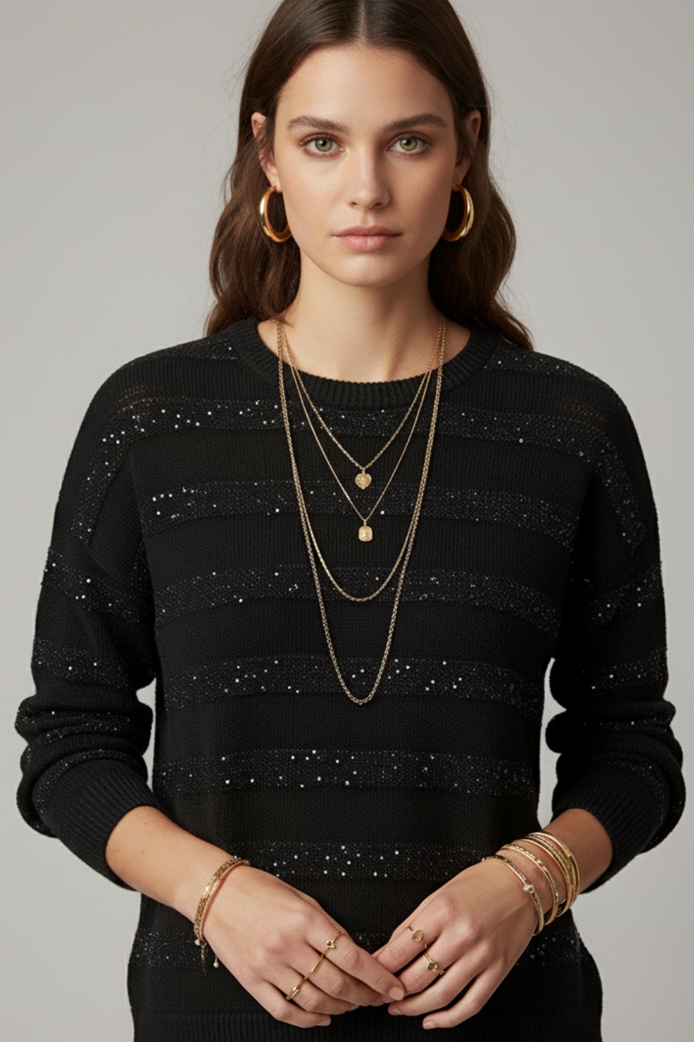 Jersey de punto a rayas negro con detalle de lentejuelas