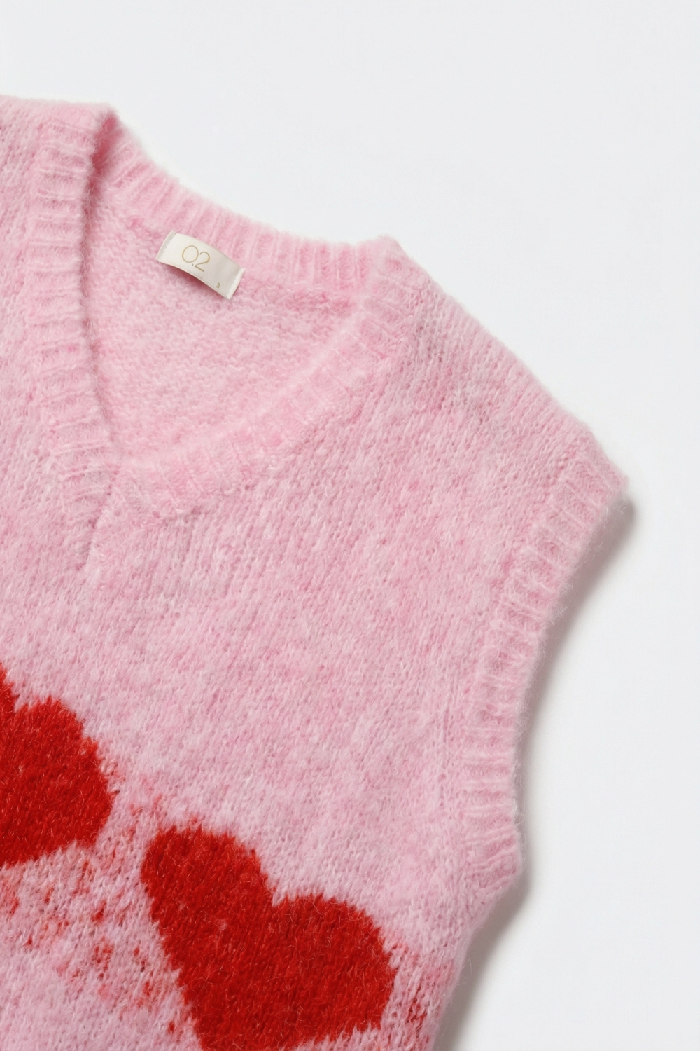 Chaleco de punto rosa esponjoso relaxed fit con motivo de corazón Chaleco de punto rosa esponjoso relaxed fit con motivo de corazón