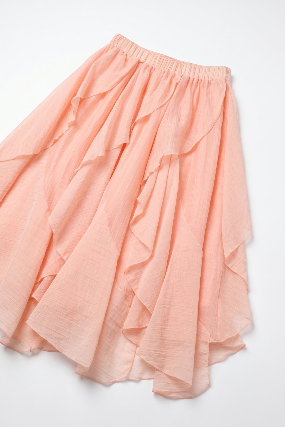 Falda midi asim&eacute;trica con volantes en tejido ligero rosa