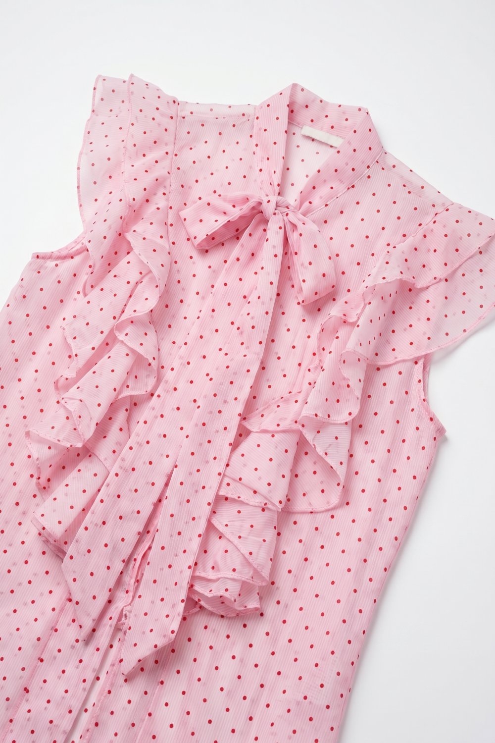 Blusa sin mangas con lazo de volantes de gasa con lunares rosa claro
