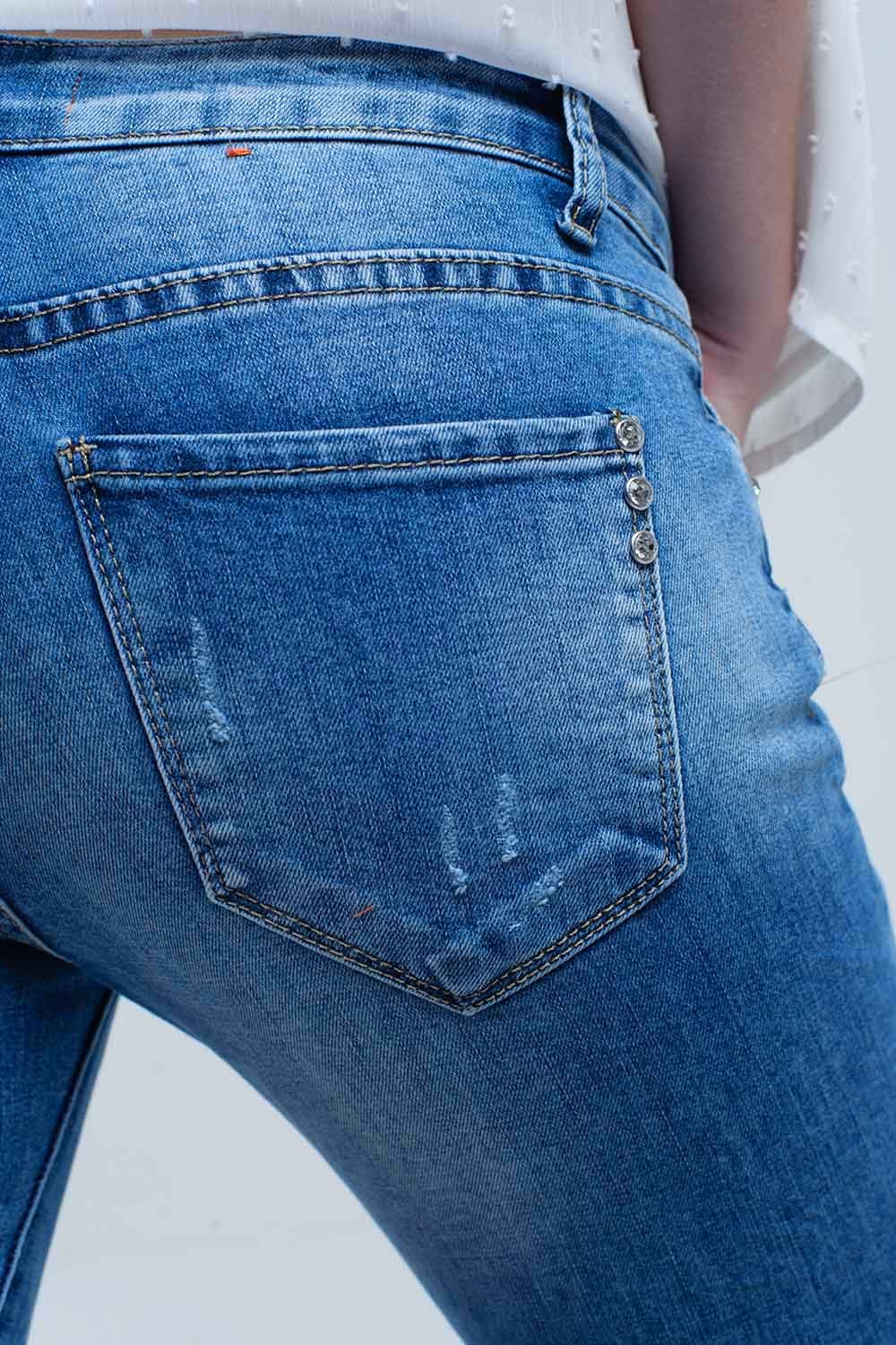 Jeans ajustados de tiro medio con roturas Jeans ajustados de tiro medio con roturas