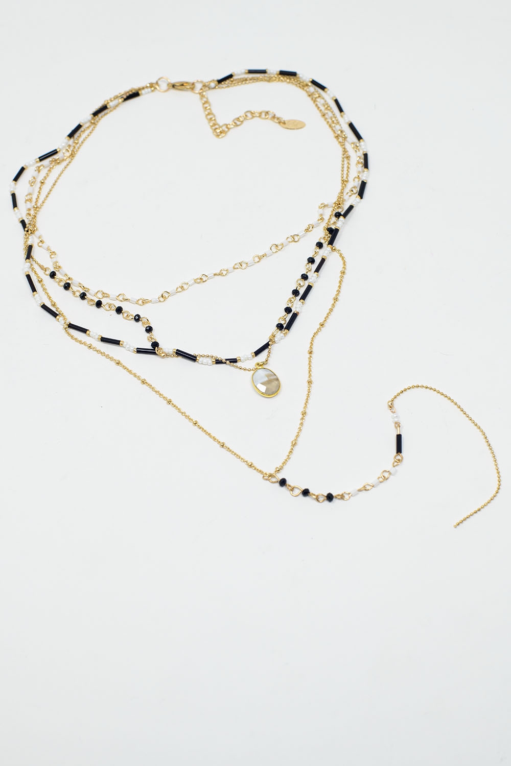 Collar 4 en 1 dorado con cuentas blancas y negras